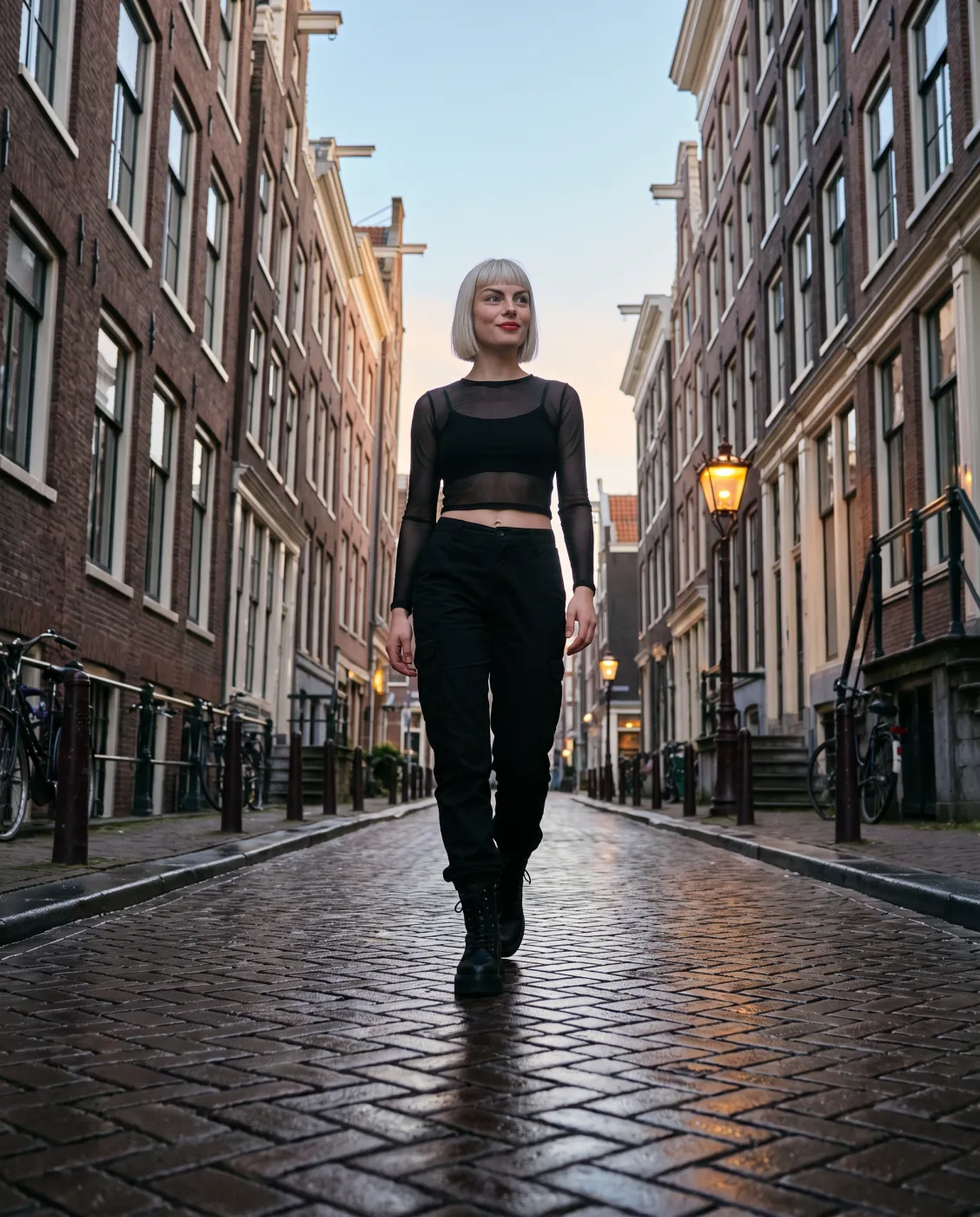 Merel van der Nacht walking down a cobbled Amsterdam street at daybreak